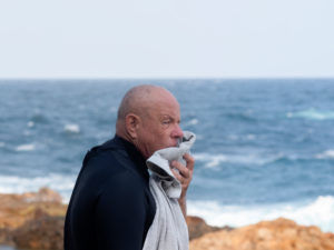 Portrait of senior man going for a swim at a rock pool in Bermagui, Australia. Portrait of senior man going for a swim at a rock pool in Bermagui, Australia.